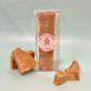 Bar of our butterscotch fudge finger with pieces of fudge placed in front of it- Rupert's Candy