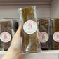 Bar of salted caramel fudge being held up- Rupert's Candy