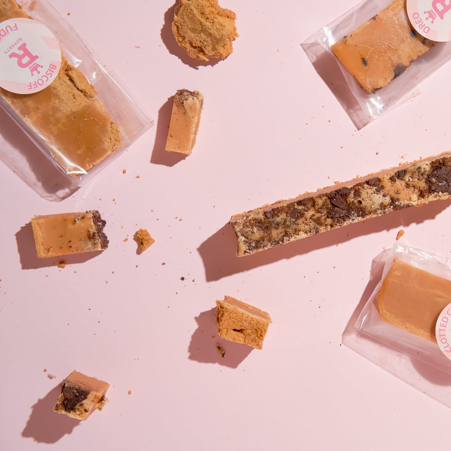 Different bars of fudge laid down scattered around-Rupert's Candy