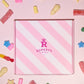 Image of our pink Rupert's Candy box with a variety of pick and mix sweets scattered around it- Rupert's Candy