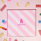 Close up of our pink Ruperts candy box with pick and mix sweets scattered around it- Rupert's Candy