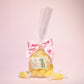 Small gift bag of sugar free sherbet lemons with some sherbet lemons place in front of the bag- Rupert's Candy