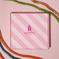 Our pink Rupert's candy box with different flavours of our cables laid next to it- Rupert's Candy