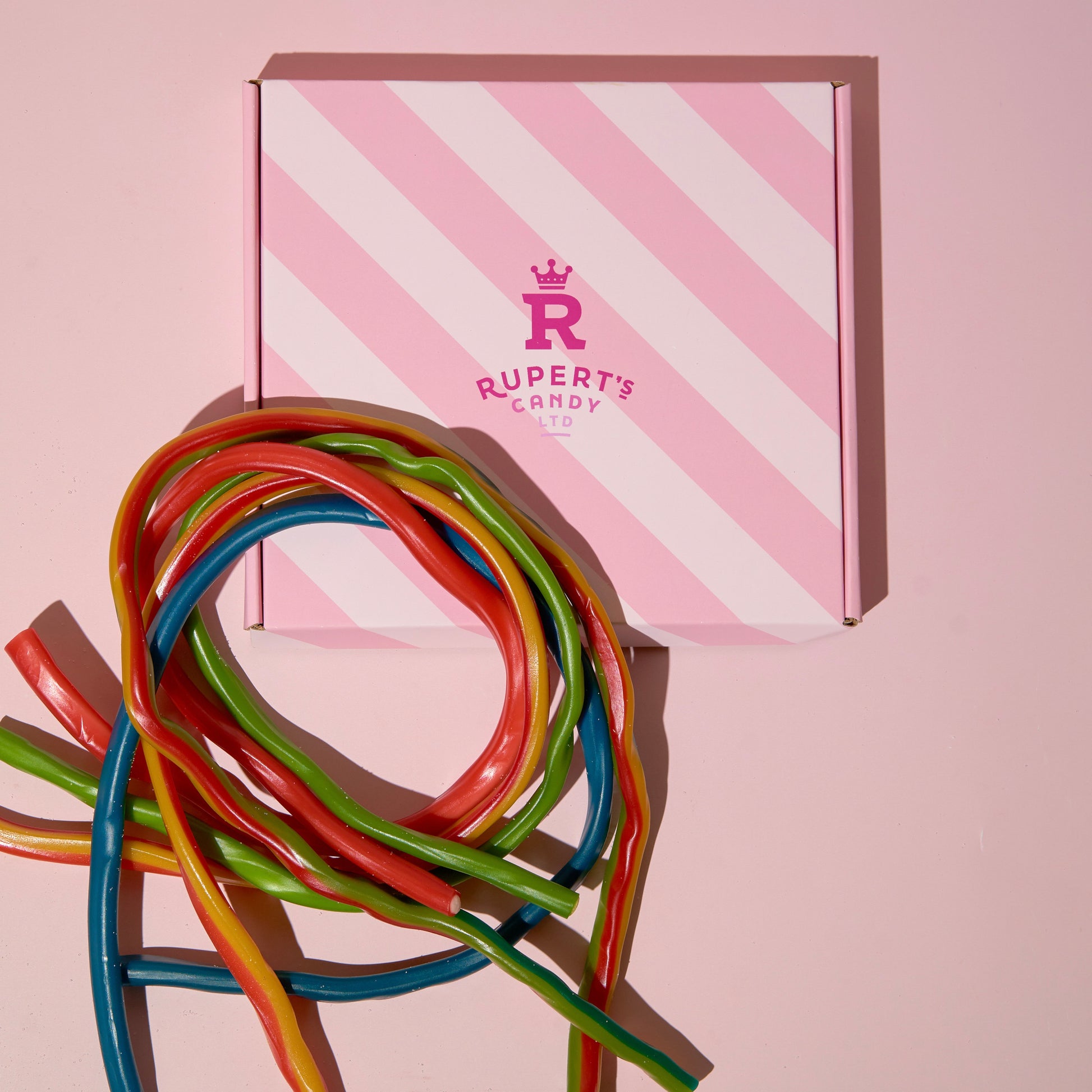 Birds Eye view of our pink Rupert's candy box and different flavours of our cables- Rupert's Candy