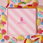 Rupert's Candys pink box with vegan pick and mix sweets scattered around it- Rupert's Candy